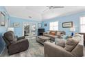 Light and airy living room with light blue walls and comfortable seating at 405 N 30Th Ave. N, North Myrtle Beach, SC 29582