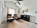 Relaxing bedroom with two chaise lounges and a ceiling fan at 230 Mint Ct., Little River, SC 29566