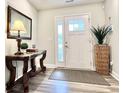 Entryway with a console table, mirror, and potted plant at 230 Mint Ct., Little River, SC 29566
