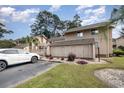 Building exterior with parking and landscaping at 3015 Old Bryan Dr. # 4-8, Myrtle Beach, SC 29577
