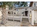 Exterior view of a two-story building with wooden decks and staircases at 3015 Old Bryan Dr. # 4-8, Myrtle Beach, SC 29577