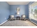 Sitting area with blue walls, hardwood floors and a patterned rug at 5700 Redgum Dr., Myrtle Beach, SC 29579