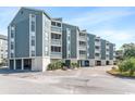 Multi-story building with balconies and parking at 1101 Possum Trot Rd. # C205, North Myrtle Beach, SC 29582