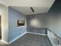 Dining area with tile floors, gray walls, and a serving hatch at 3831 Masters Ct. # 137, Myrtle Beach, SC 29577