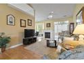 Bright living room with hardwood floors, fireplace, and ample seating at 490 Blackberry Ln., Myrtle Beach, SC 29579