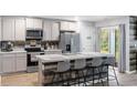 Modern kitchen with stainless steel appliances and an island at 338 Spruce Pine Way, Conway, SC 29526