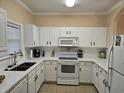 Clean, white kitchen with appliances at 5801 Oyster Catcher Dr. # 413, North Myrtle Beach, SC 29582