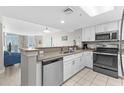Modern kitchen with white cabinets, stainless steel appliances, and ocean view at 2701 S Ocean Blvd. # 1817, North Myrtle Beach, SC 29582
