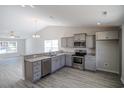 Modern kitchen with stainless steel appliances and granite countertops at 318 Barn Owl Way, Conway, SC 29527