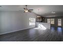 Open living room with high ceilings and wood-look floors at 318 Barn Owl Way, Conway, SC 29527