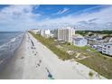 Wide aerial showcasing beach, ocean, and beachfront high-rise buildings at 4105 S Ocean Blvd. S # 102, North Myrtle Beach, SC 29582