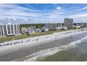 Aerial perspective of beachfront properties, including high-rises and smaller buildings at 4105 S Ocean Blvd. S # 102, North Myrtle Beach, SC 29582