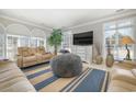 Spacious living room with beige sofas and large TV at 204 5Th Ave. N, North Myrtle Beach, SC 29582