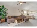 Open living and dining area with neutral tones and L-shaped sofa at 332 Kiskadee Loop # L, Conway, SC 29526