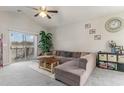 Relaxing living room, featuring an L-shaped sofa and sliding door to balcony at 332 Kiskadee Loop # L, Conway, SC 29526