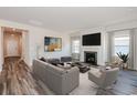 Gathering room with fireplace and staged furniture at 8605 Pinnacle Cove Way, Longs, SC 29568