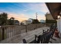 Deck with rocking chairs and sunset view at 3801 N Ocean Blvd., North Myrtle Beach, SC 29582