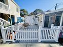 Private deck with table and chairs, adjacent to shed at 6001 - 1781 S Kings Hwy., Myrtle Beach, SC 29575