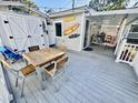 Relaxing outdoor deck with table, chairs, and shed at 6001 - 1781 S Kings Hwy., Myrtle Beach, SC 29575