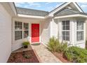 Welcoming entryway with red door and bay window at 419 Mckendree Ln., Myrtle Beach, SC 29579