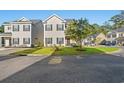 Two-story townhome with landscaping and street view at 154 Terracina Circle, Myrtle Beach, SC 29588