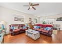 Spacious living room with hardwood floors and leather sofas at 154 Terracina Circle, Myrtle Beach, SC 29588