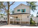 Two-story home with front porch and walkway at 6001-7038 S Kings Hwy., Myrtle Beach, SC 29575