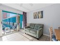 Living area with sofa, tiled floor, and balcony access at 1600 S Ocean Blvd. # 346, Myrtle Beach, SC 29577