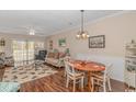 Condo living room with coastal decor and access to balcony at 5804 Longwood Dr. # 203, Murrells Inlet, SC 29576