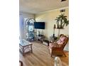 Living room with wicker furniture and large TV at 9580 Shore Dr. # 303, Myrtle Beach, SC 29572