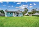 Side view of charming light blue house with large lawn at 829 44Th Ave. N, Myrtle Beach, SC 29577