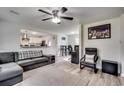 Living room with L-shaped sectional sofa and view of kitchen at 829 44Th Ave. N, Myrtle Beach, SC 29577