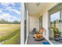 Relaxing screened porch with rocking chairs overlooking the golf course at 646 River Oak Dr. # 47-A, Myrtle Beach, SC 29579
