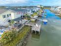 Aerial view of waterfront property with a dock and canal access at 314 45Th Ave. N, North Myrtle Beach, SC 29582