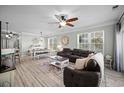 Spacious living room with hardwood floors, comfortable seating, and a dining area at 100 Ella Kinley Circle # 301, Myrtle Beach, SC 29588