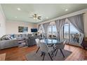 Spacious living room with ocean view, hardwood floors, and comfy furniture at 132 N Waccamaw Dr., Murrells Inlet, SC 29576