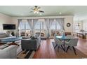 Spacious living room with ocean view, hardwood floors, and comfy furniture at 132 N Waccamaw Dr., Murrells Inlet, SC 29576