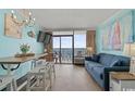 Living room with ocean view and balcony at 6900 Ocean Blvd. N # 1537, Myrtle Beach, SC 29572