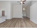 Open living room with high ceilings, ceiling fan, and wood-look floors at 612 Woodside Dr., Conway, SC 29526