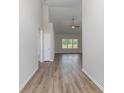 Bright entry hall with wood-look flooring and view of spacious living area at 612 Woodside Dr., Conway, SC 29526