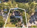 House with a large lot and a pond nearby at 1495 Hawthorn Dr., Pawleys Island, SC 29585