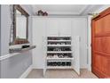 Spacious entry closet with built-in shoe storage and shelving at 1346 Villa Marbella Ct. # 301, Myrtle Beach, SC 29572