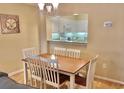 Dining area with table and chairs, kitchen view at 410 Melrose Pl. # 203, Myrtle Beach, SC 29572