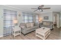 Living room with gray couches, a coffee table, and beach-themed decor at 6001-1157 S Kings Hwy., Myrtle Beach, SC 29575