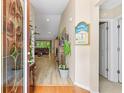 Bright and airy entryway with hardwood floors and view of living room at 544 Running Deer Trail, Myrtle Beach, SC 29588