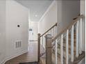 Modern staircase with wooden handrail and carpeted steps at 300 Golan Circle # C, Myrtle Beach, SC 29579