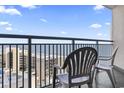 Balcony with ocean view and chairs at 205 N 74Th Ave. N # 1106, Myrtle Beach, SC 29572