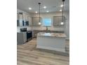 Modern kitchen with granite countertops and island at 293 Hawks Run Dr., Calabash, NC 28467