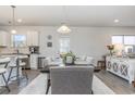 Kitchen features a dining area with a wooden table and gray cushioned chairs at 3519 Cornflower Way, Conway, SC 29526