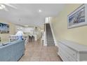 Open living room with kitchen and stairs at 912-B S Ocean Blvd., Surfside Beach, SC 29575